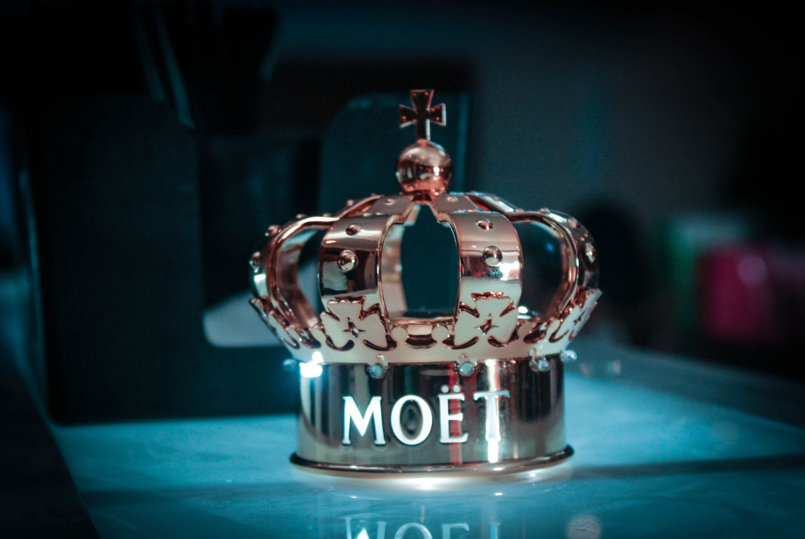 A luxurious gold crown with Moët branding, perfect for adding royal charm to any space.