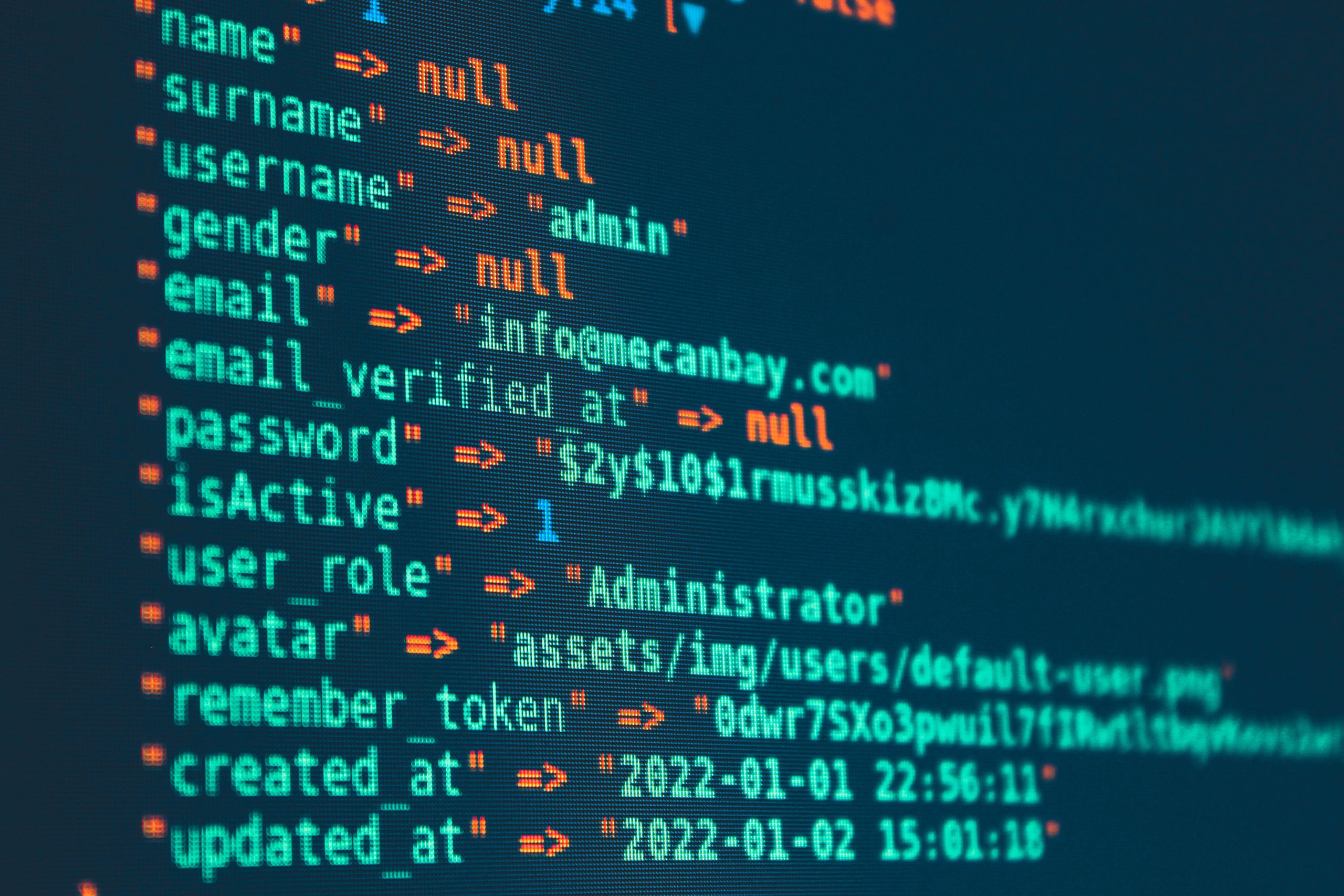 Vibrant close-up of code displayed on a monitor with various programming details.